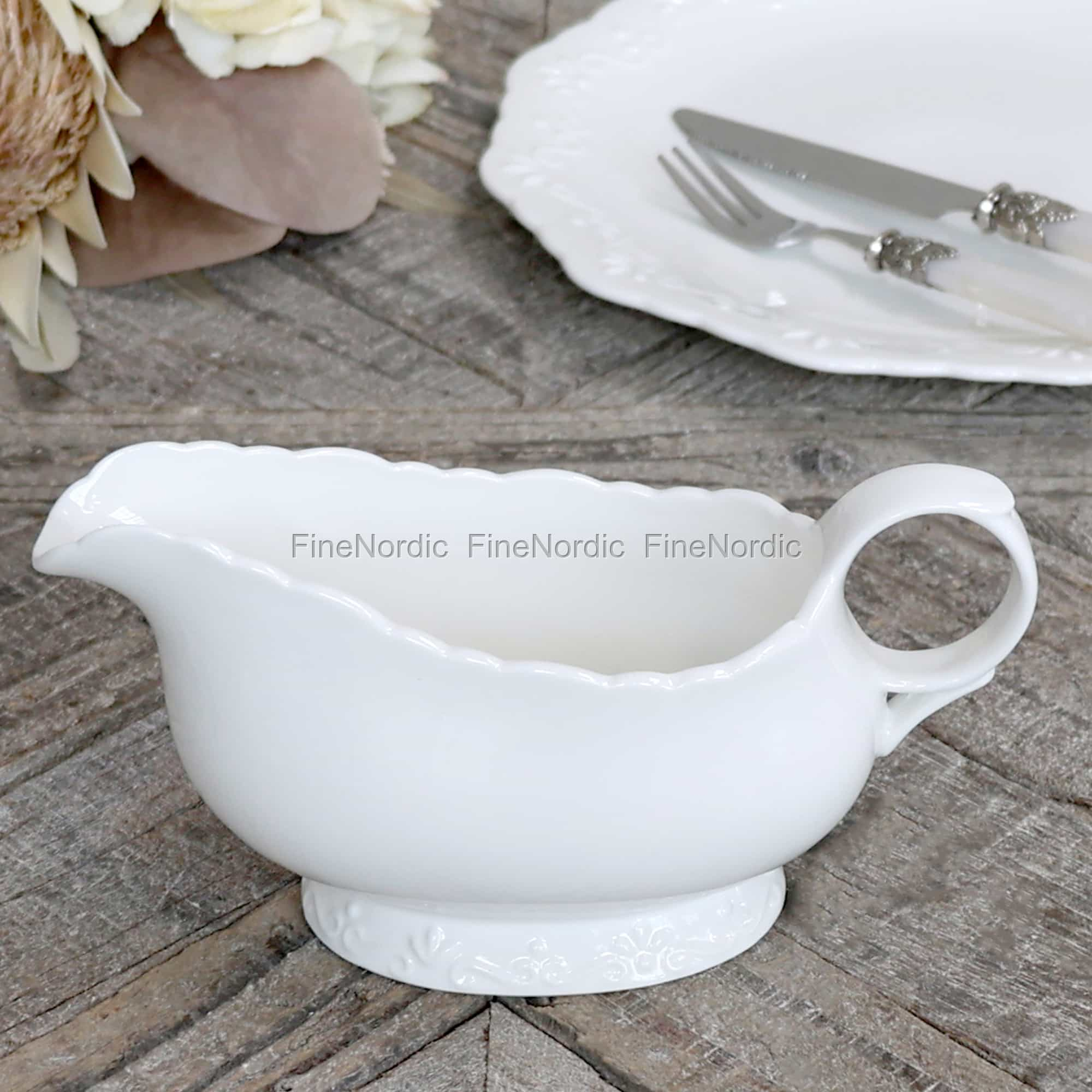 white ceramic gravy boat