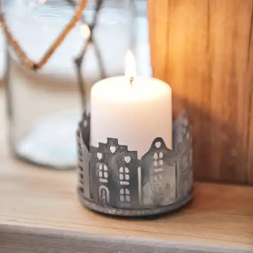 https://images.finenordic.com/image/72991-medium-1688493538/ib-laursen-candle-holder-for-tealight-punched-houses-zinc.webp