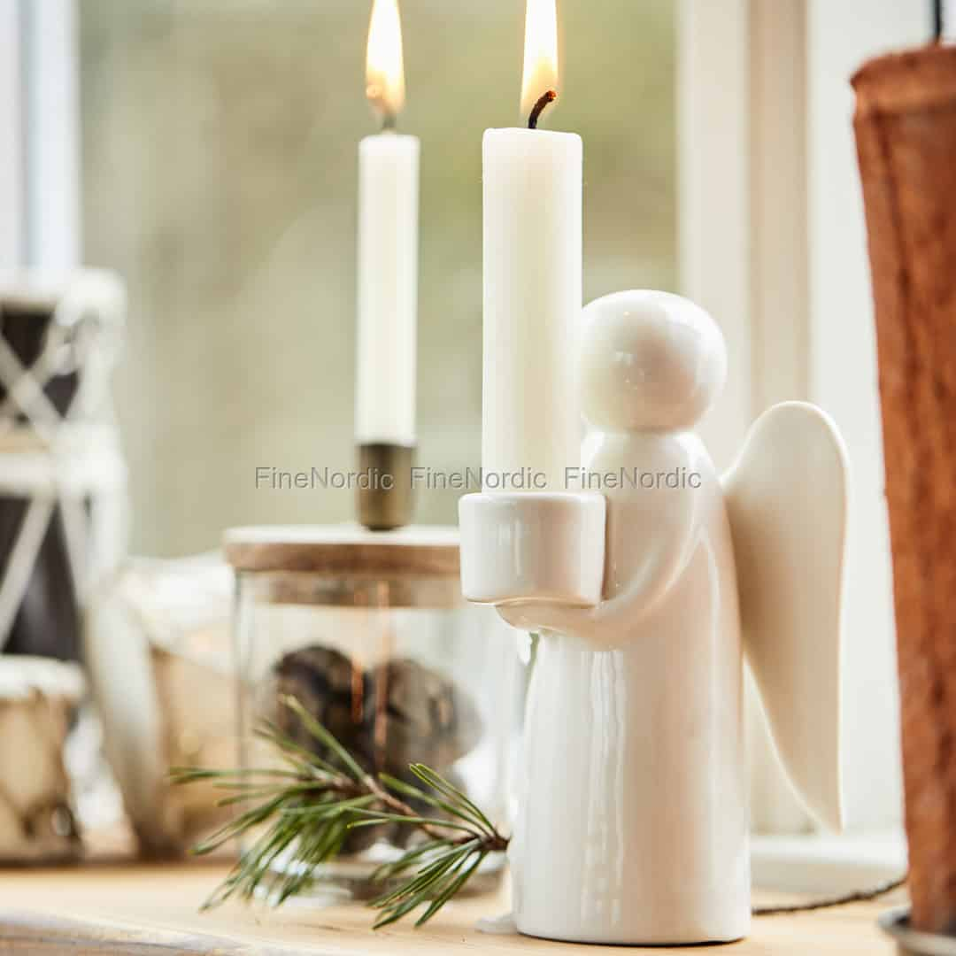 https://images.finenordic.com/image/73130-mediumlarge-1688493633/ib-laursen-candle-holder-for-tall-dinner-candle-ca-2-cm-angel.jpg